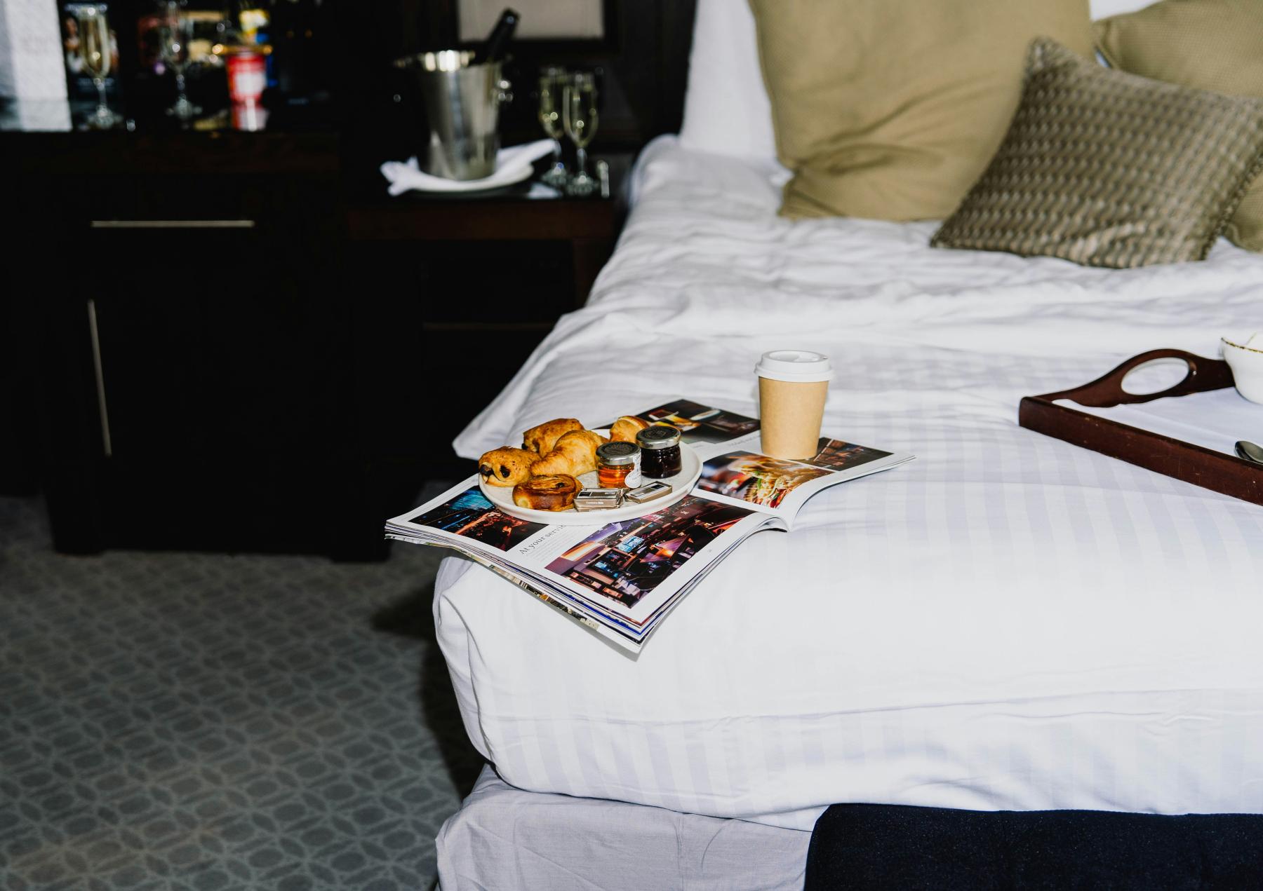 hotel room hotel room with snacks in bed